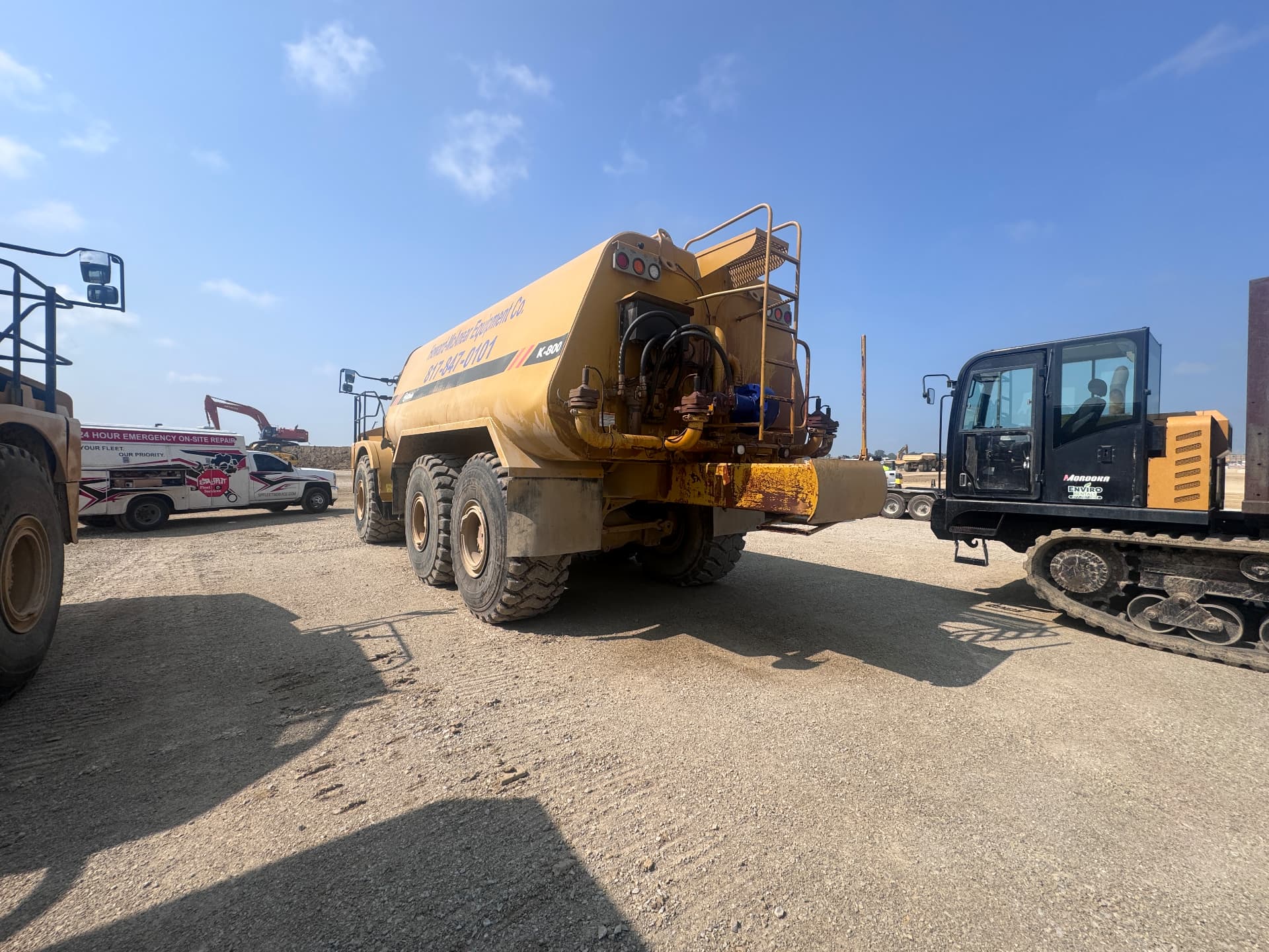 Commercial fleet parked in a yard awaiting mobile maintenance