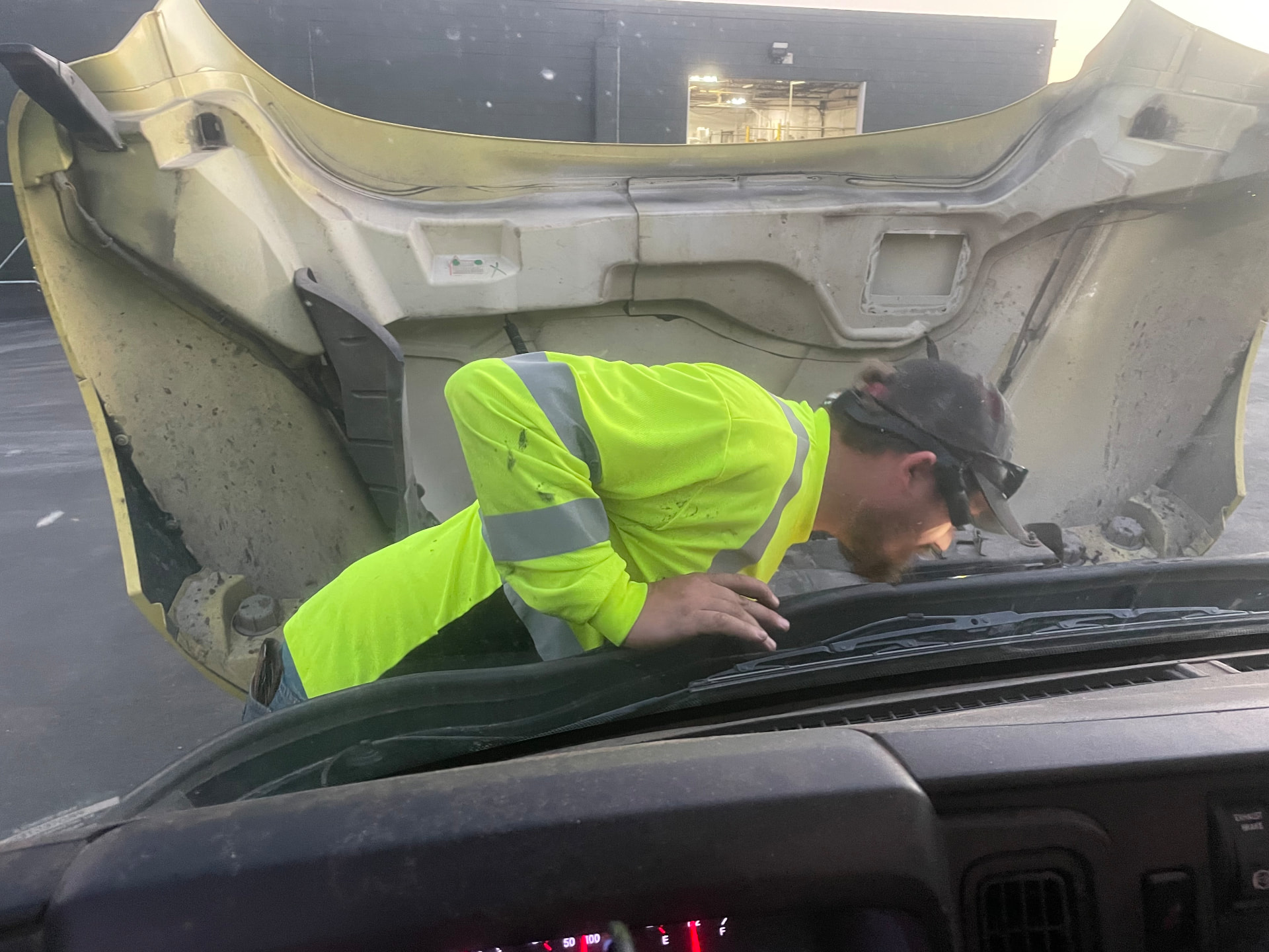 StayPut technician inspecting the engine bay of a commercial truck