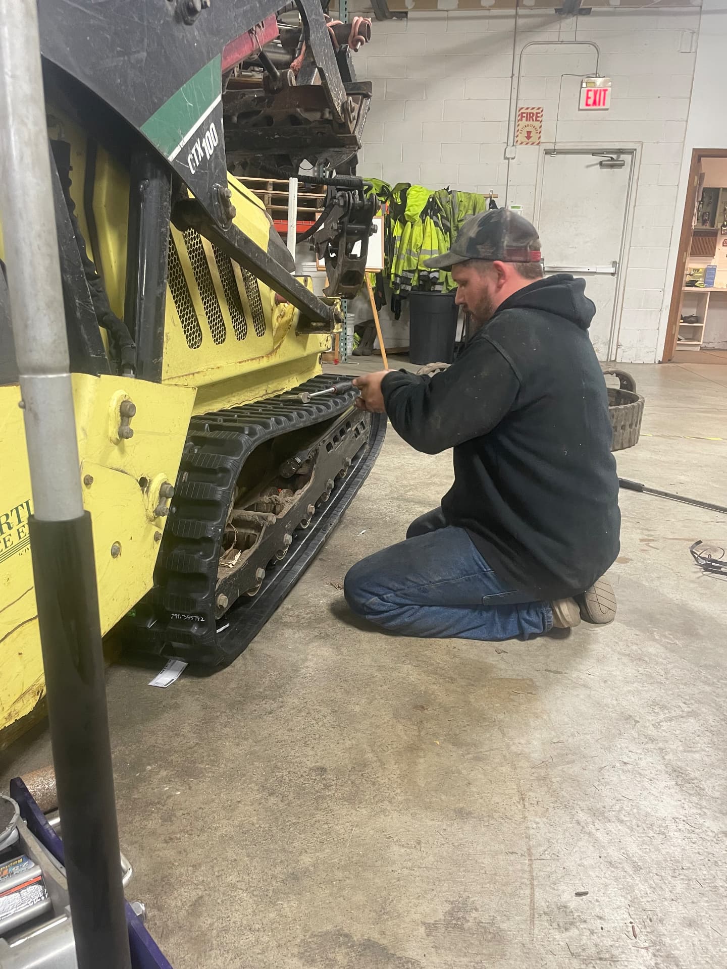 StayPut technician replacing the track on a CTX100 compact track loader