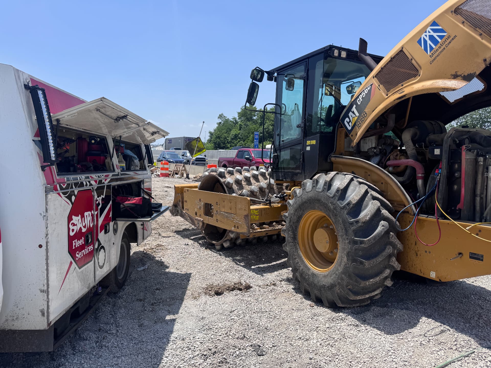 StayPut service truck repairing a CAT compactor on an Indianapolis job site